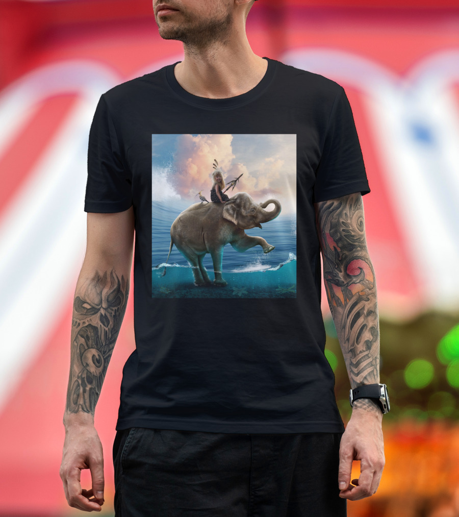 Child with Feathers Riding Elephant in Ocean Waves T-Shirt