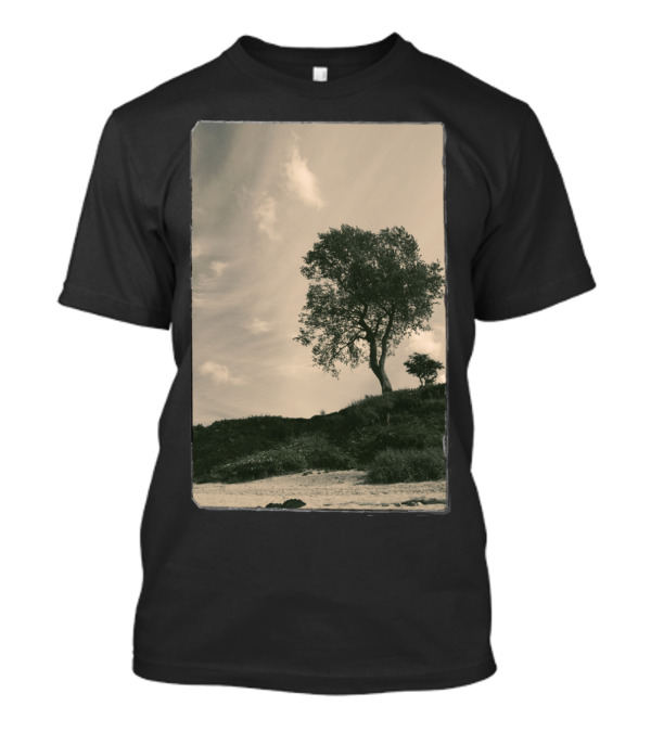 Tree On Grassy Hillside Under Cloudy Sky T-Shirt