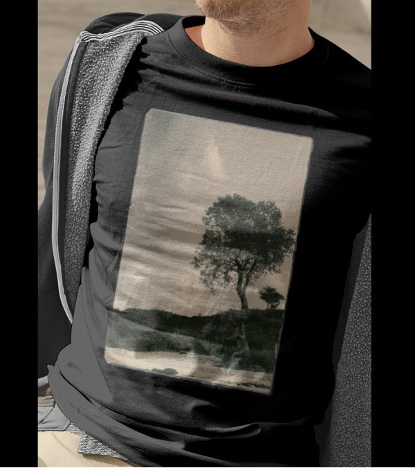 Tree On Grassy Hillside Under Cloudy Sky T-Shirt