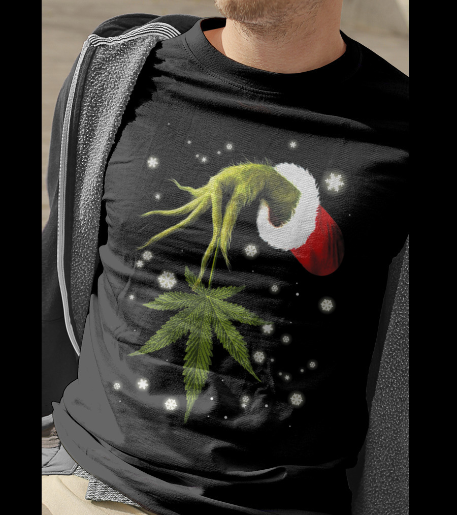 Grinch Hand Holding Cannabis Leaf With Santa Hat And Snowflakes T-Shirt