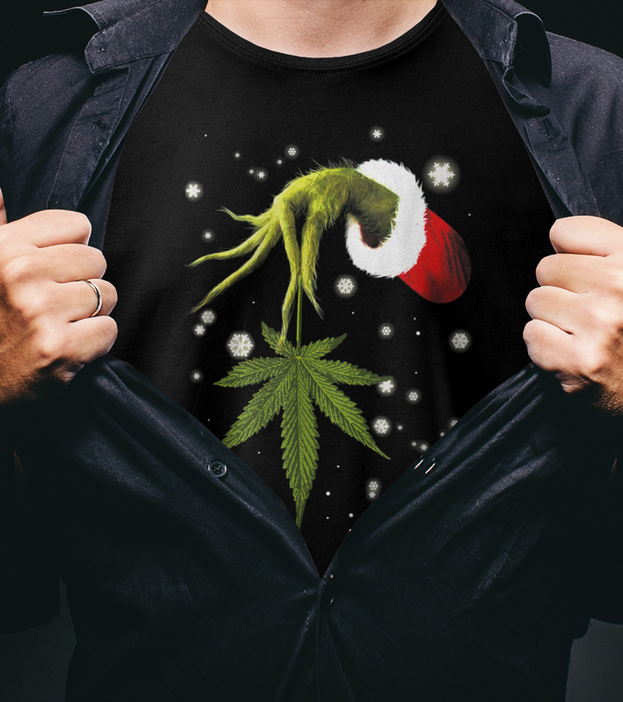 Grinch Hand Holding Cannabis Leaf With Santa Hat And Snowflakes T-Shirt