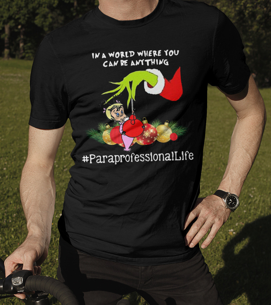 In A World Where You Can Be Anything Hand Grinch Holding Ornaments #ParaprofessionalLife T-Shirt