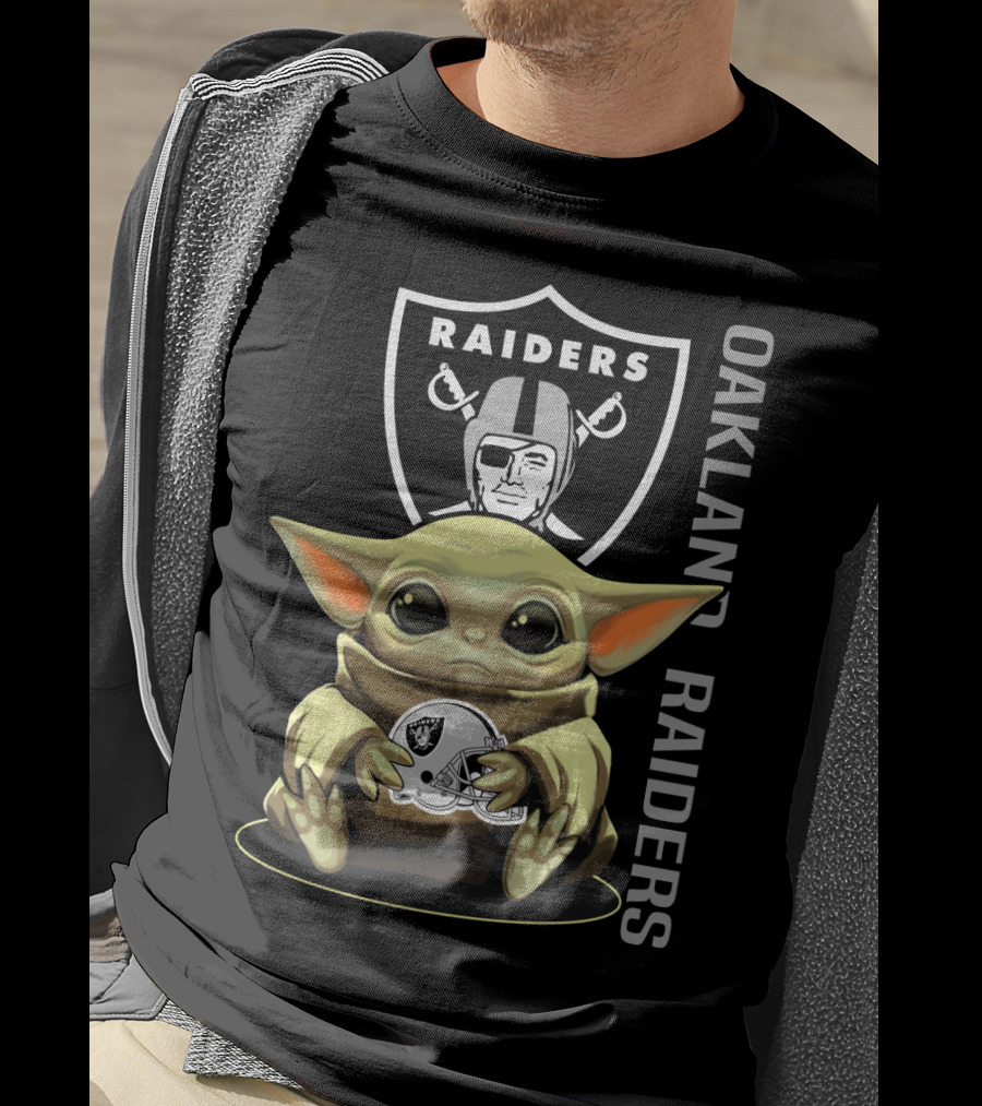 Baby Yoda Holding Oakland Raiders Helmet With Raiders Logo In Background T-Shirt