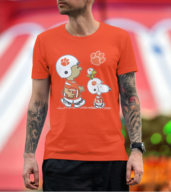 Premium T-Shirt: Clemson Tigers Snoopy Football Helmets and Paw Print Charlie Brown Woodstock T-Shirt Clemson Tigers Snoopy Football Helmets and Paw Print Charlie Brown Woodstock T-Shirt