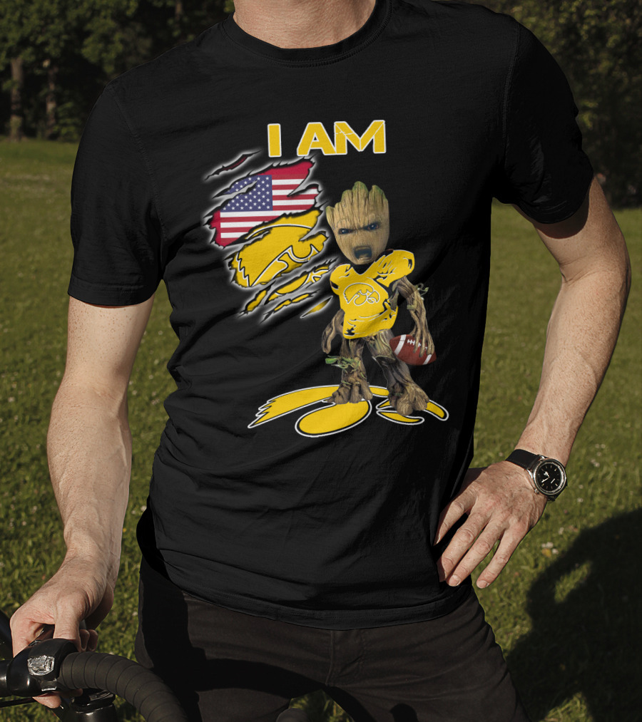 I Am Hawkeyes Baby Groot Holding Football With Usa Flag And Iowa Hawkeyes T-Shirt