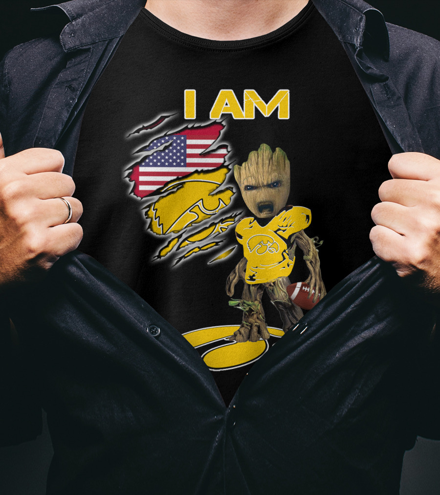 I Am Hawkeyes Baby Groot Holding Football With Usa Flag And Iowa Hawkeyes T-Shirt