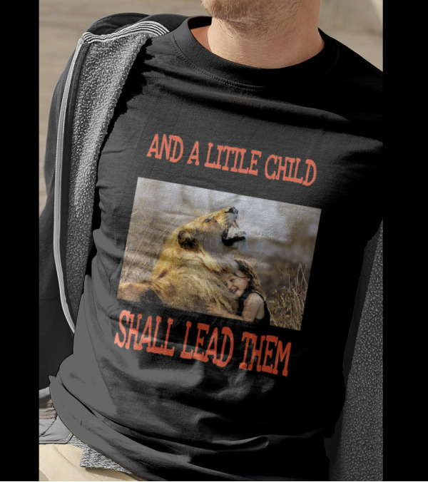 AND A LITTLE CHILD SHALL LEAD THEM Hugging A Lion In A Field T-Shirt