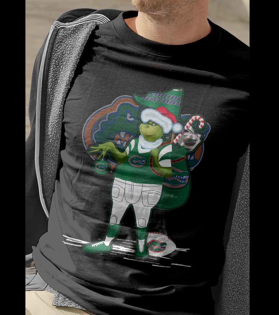Grinchxmas Wearing Santa Hat Florida Gators With Gator Logo And Candy Cane T-Shirt