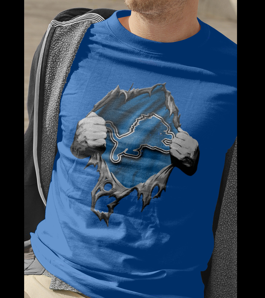 Torn Skin Revealing Detroit Lions Emblem On Blue T-Shirt