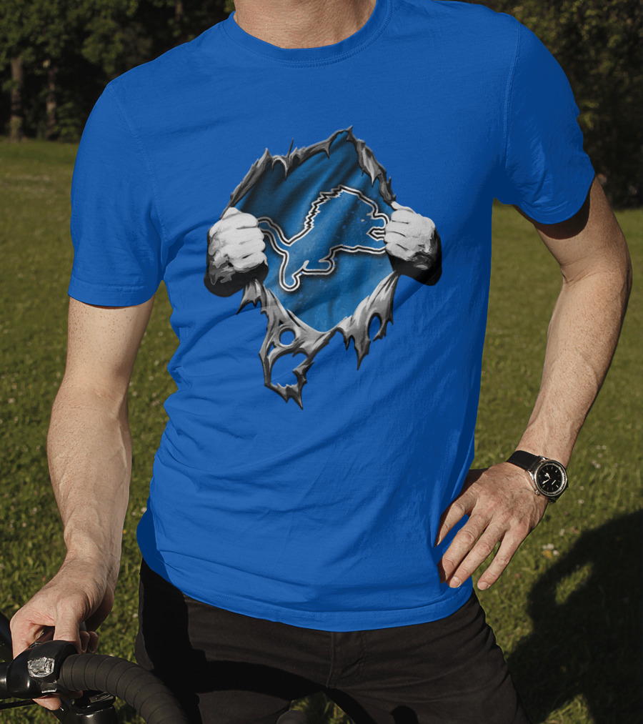 Torn Skin Revealing Detroit Lions Emblem On Blue T-Shirt