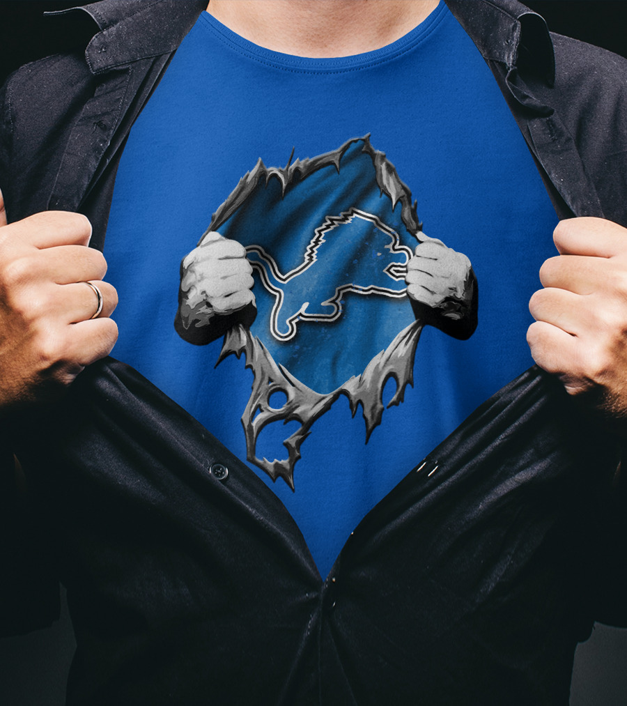 Torn Skin Revealing Detroit Lions Emblem On Blue T-Shirt