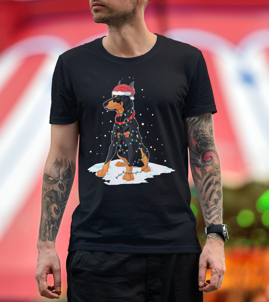 Doberman Wearing Santa Hat Wrapped in Christmas Lights on Snow T-Shirt
