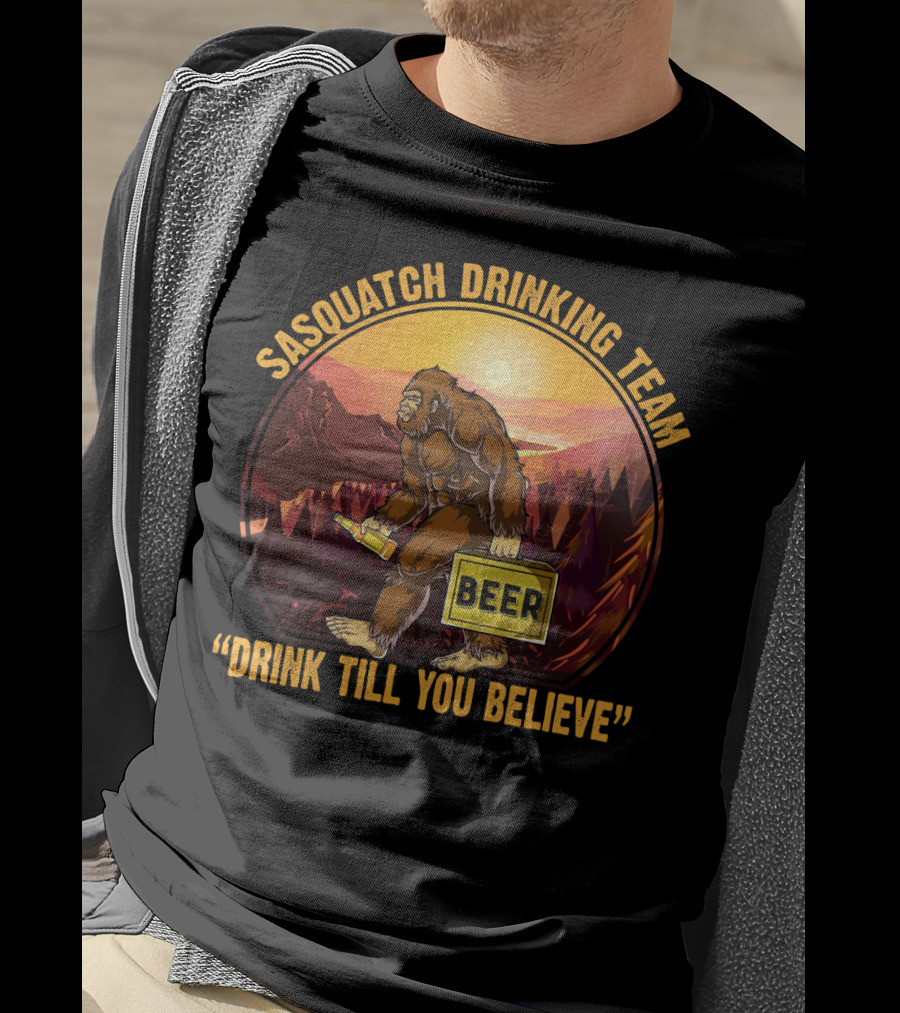 Sasquatch Drinking Team Beer Wilderness Sunset Funny Bigfoot Drink Till You Believe T-Shirt