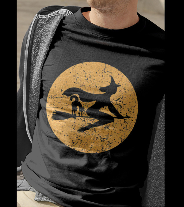 Witch On A Broomstick With Cat Silhouette Against Moon Background T-Shirt