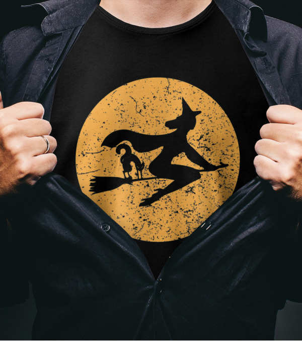 Witch On A Broomstick With Cat Silhouette Against Moon Background T-Shirt