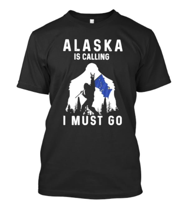 Alaska Is Calling I Must Go Bigfoot Holding Alaska Flag T-Shirt