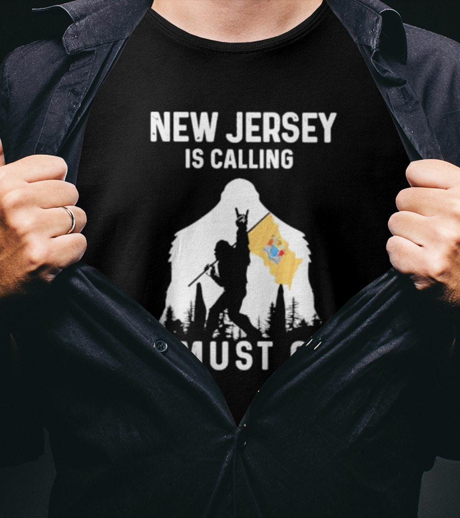 New Jersey Is Calling I Must Go Bigfoot Holding New Jersey Flag T-Shirt
