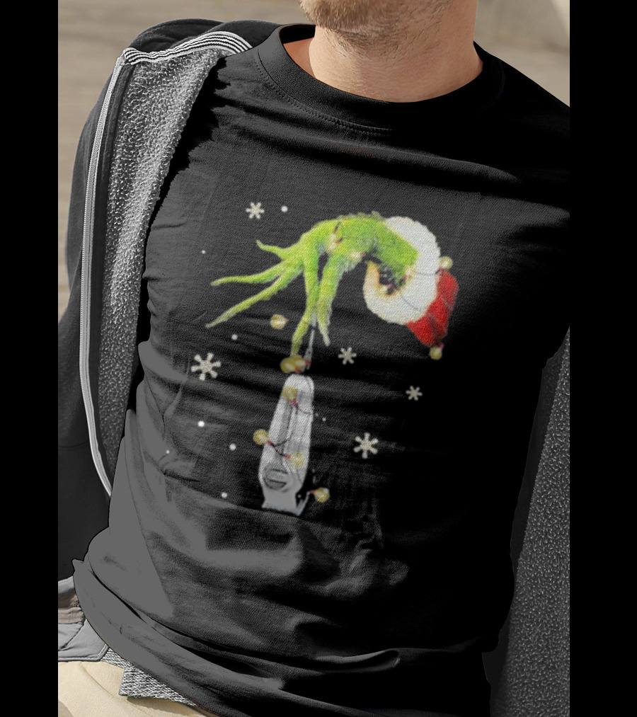 Grinch Christmas Hand Holding Clipper Snowflakes Santa Hat T-Shirt