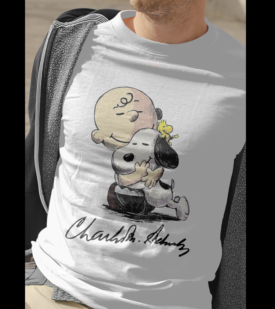 Snoopy And Charlie Brown Hugging By Charles M. Schulz T-Shirt