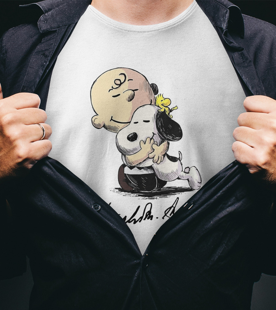 Snoopy And Charlie Brown Hugging By Charles M. Schulz T-Shirt