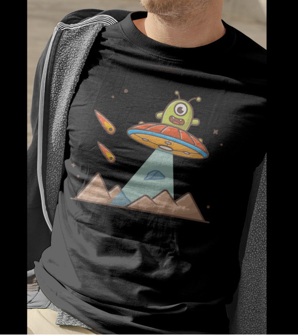 Cute Alien In UFO Hovering Over Mountains With Meteorites T-Shirt