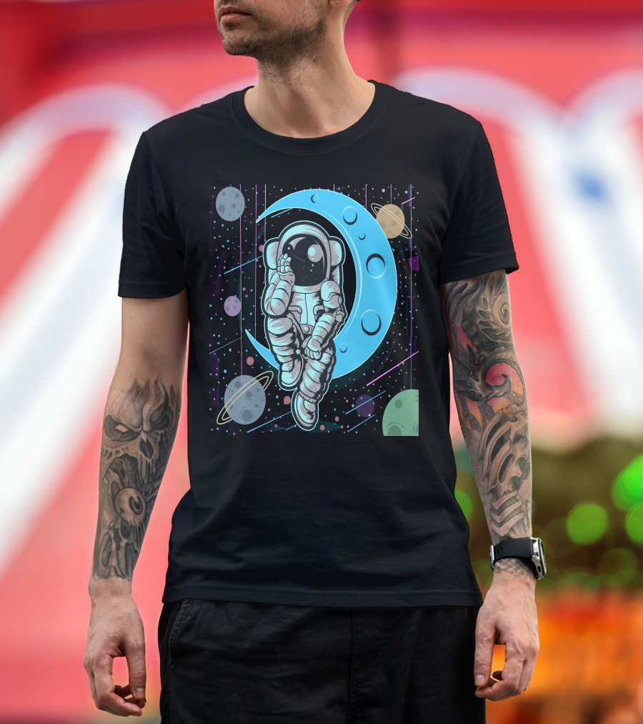 Thoughtful Astronaut on Crescent Moon with Colorful Planets T-Shirt