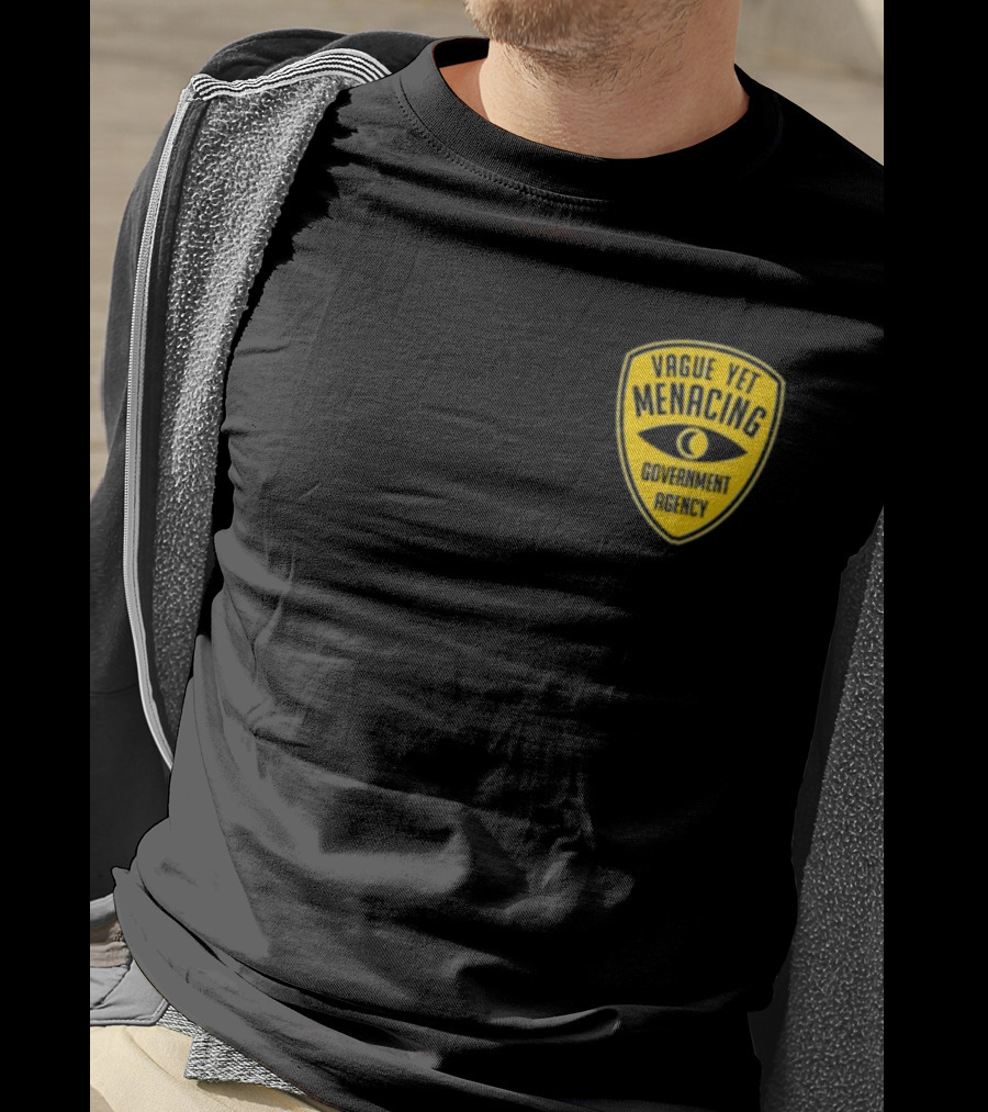 Vague Yet Menacing Government Agency Yellow Badge With Eye T-Shirt