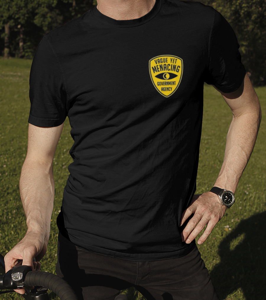 Vague Yet Menacing Government Agency Yellow Badge With Eye T-Shirt