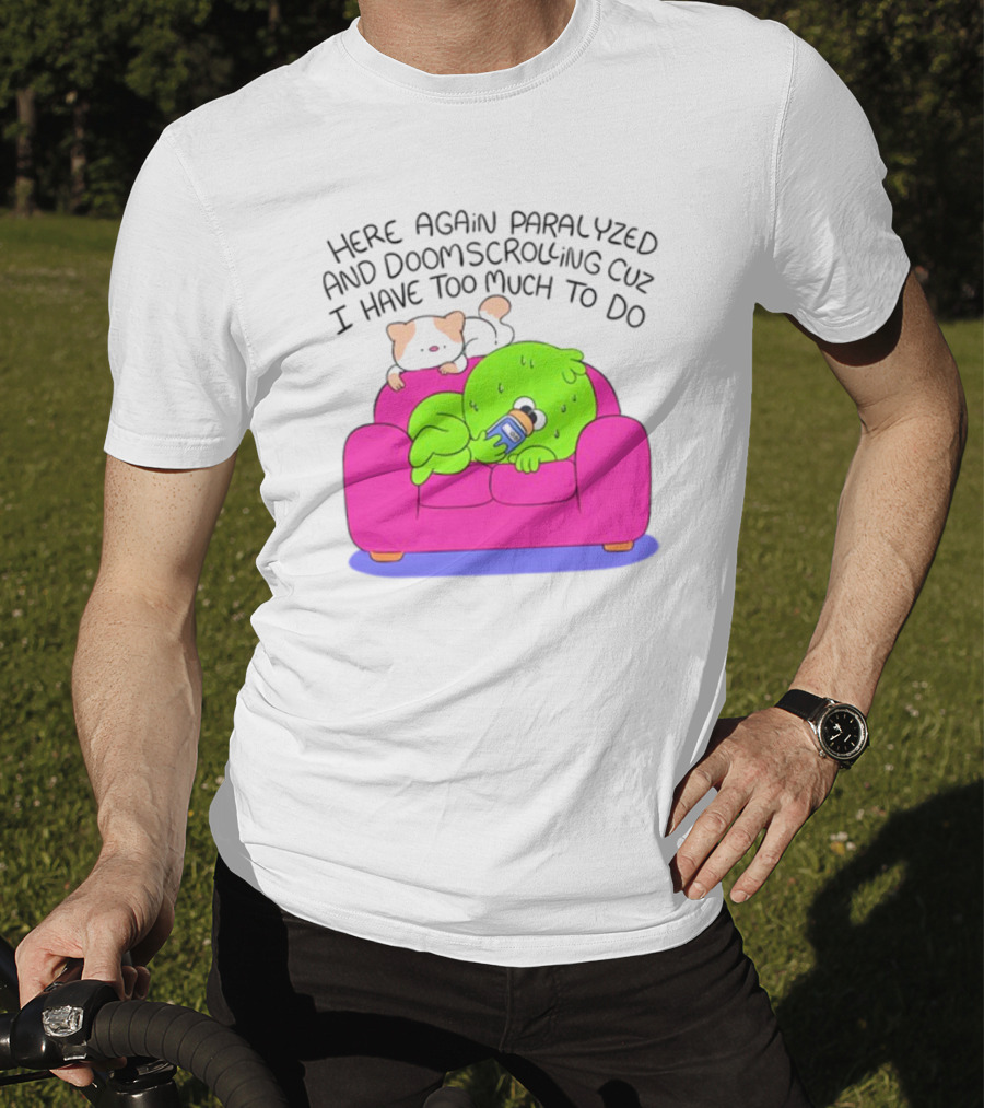 Here Again Paralyzed And Doomscrolling Cuz I Have Too Much To Do Quirky Green Figure Relaxing On Pink Couch With Cute Dog T-Shirt