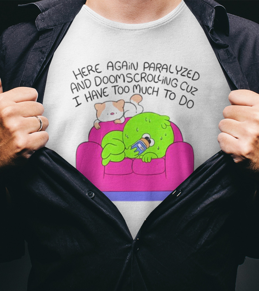 Here Again Paralyzed And Doomscrolling Cuz I Have Too Much To Do Quirky Green Figure Relaxing On Pink Couch With Cute Dog T-Shirt