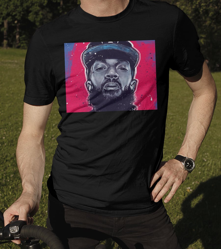 Nipsey Hussle Bold Street Style Portrait With Cap And Vibrant Red Blue T-Shirt