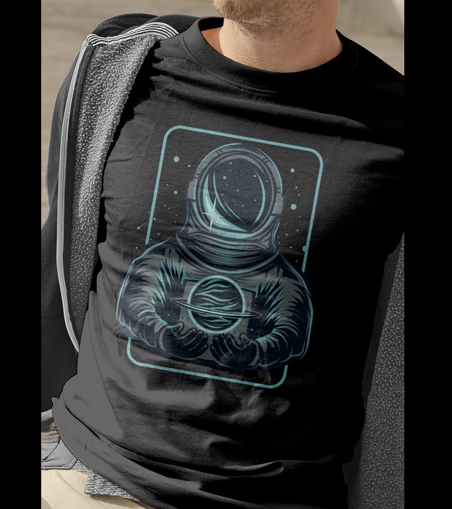 Astronaut Holding A Saturn-Like Planet In Space-Themed T-Shirt