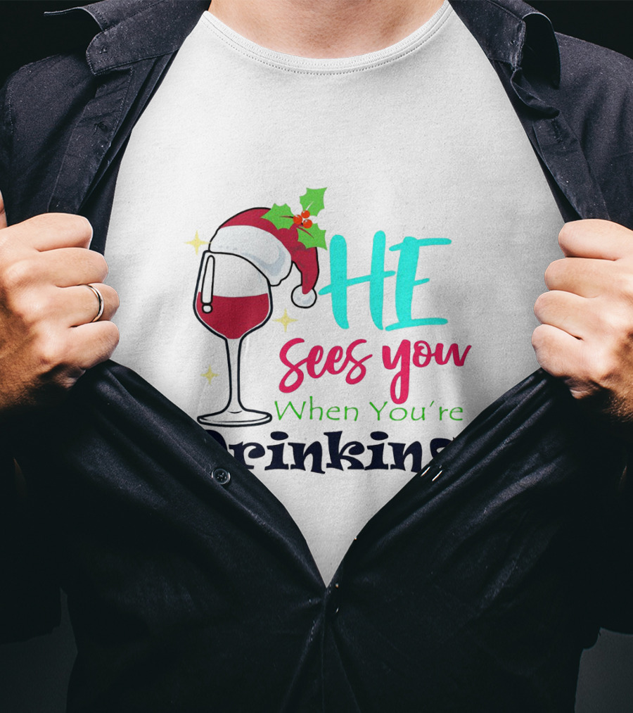 Santa Hat On Wine Glass With 'He Sees You When You're Drinking' Christmas Festive T-Shirt