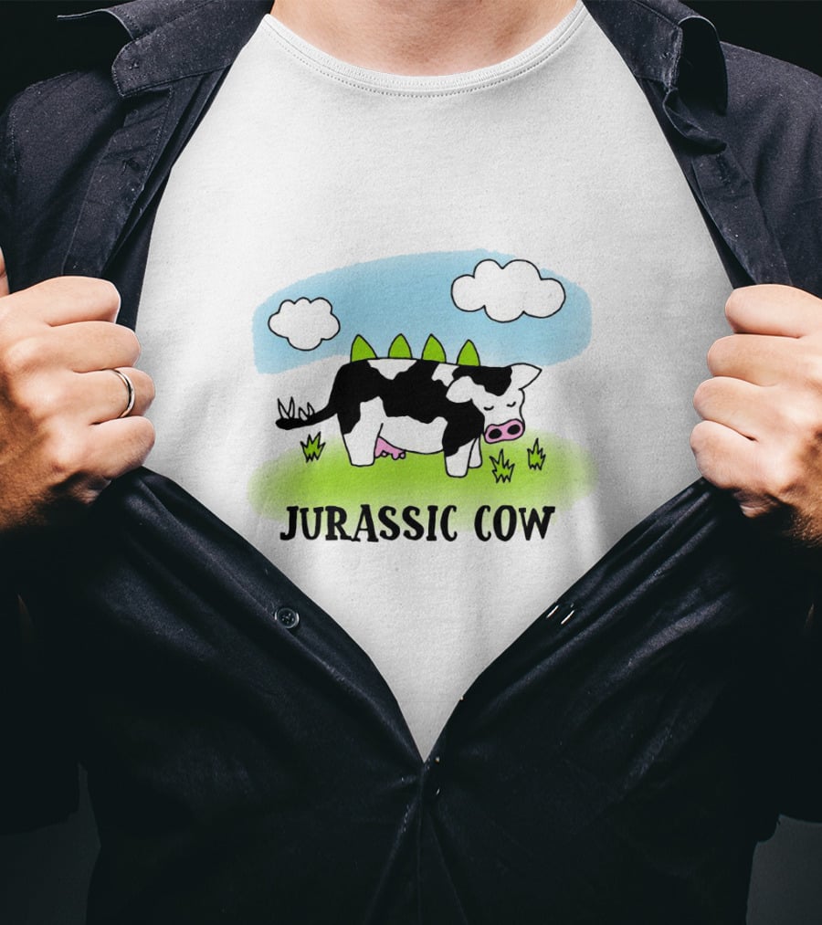 Jurassic Cow Grazing With Dinosaur Spikes Under Blue Sky And Clouds In Cartoon T-Shirt