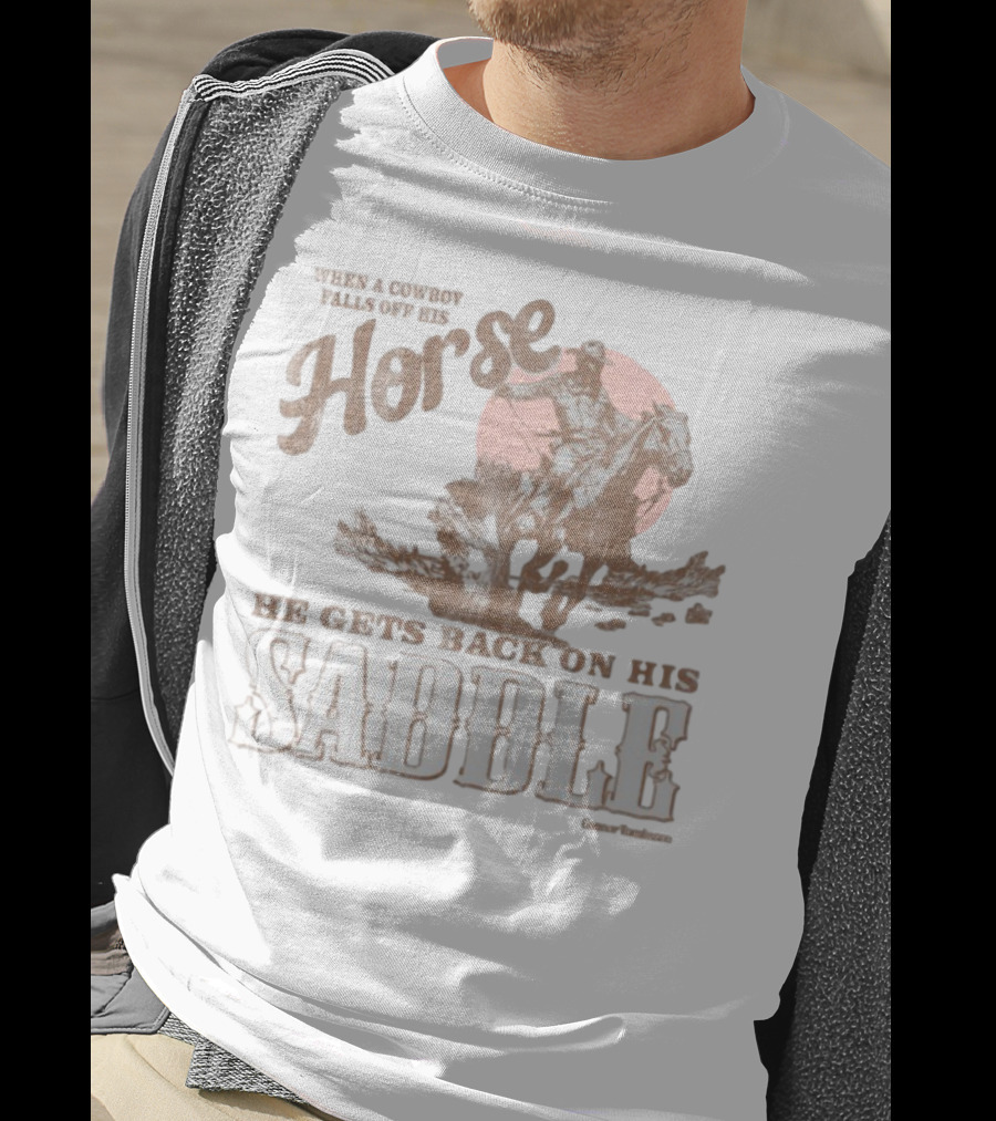 When A Cowboy Falls Off His Horse He Gets Back On His Saddle T-Shirt