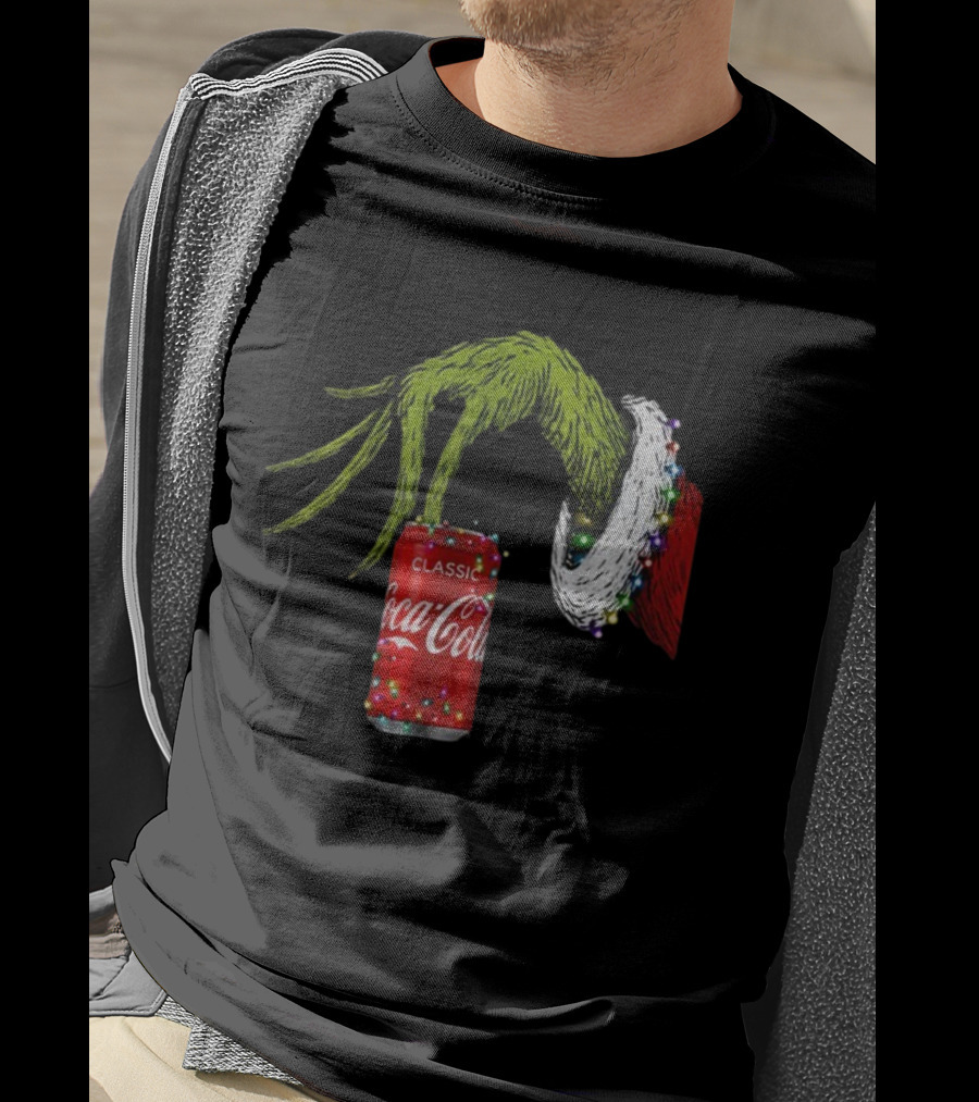 Grinch Hand Holding Coca-Cola Can Wrapped In Christmas Lights Merry Christmas T-Shirt