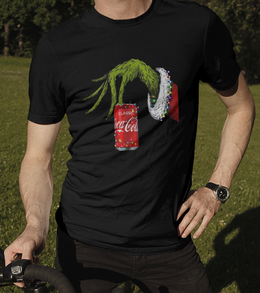 Grinch Hand Holding Coca-Cola Can Wrapped In Christmas Lights Merry Christmas T-Shirt