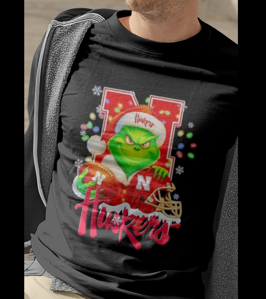 Grinch Santa With Nebraska Cornhuskers Helmet And Football Merry Christmas Huskers T-Shirt