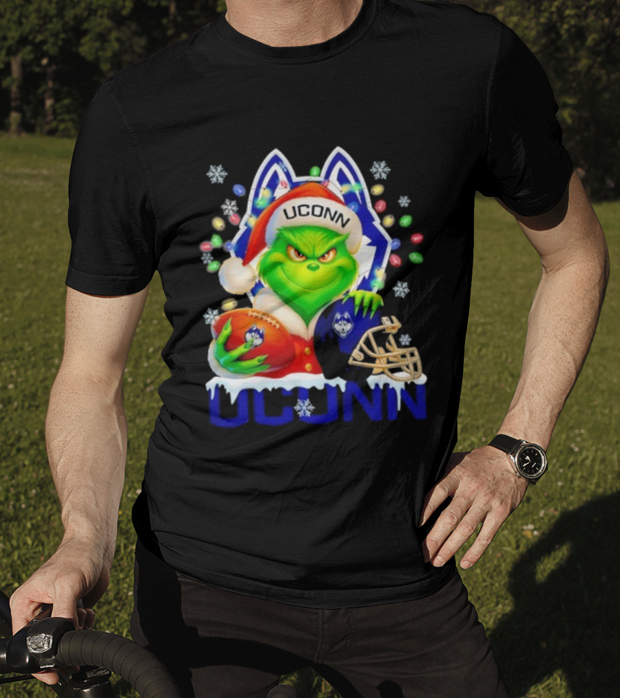 Grinch Wearing Santa Hat With UConn Huskies Football And Helmet Merry Christmas T-Shirt
