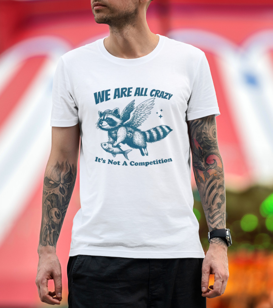 Raccoon With Wings Holding Fish We Are All Crazy It's Not A Competition T-Shirt