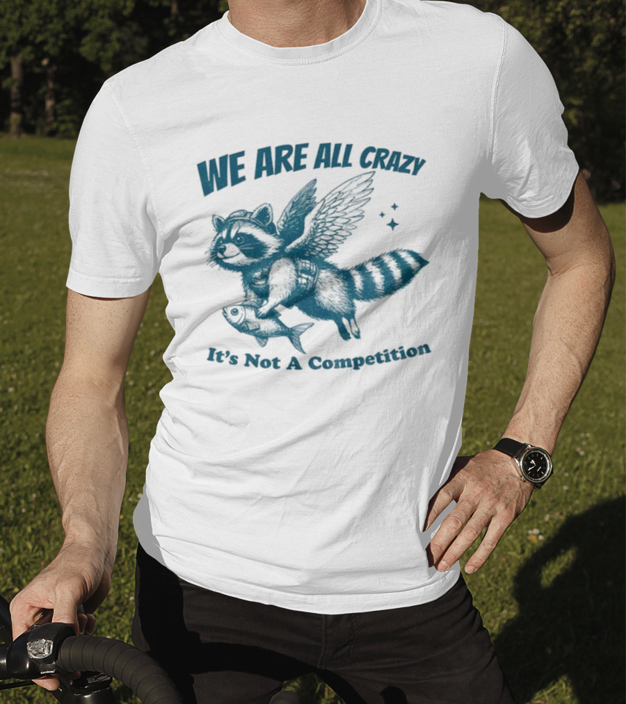 Raccoon With Wings Holding Fish We Are All Crazy It's Not A Competition T-Shirt
