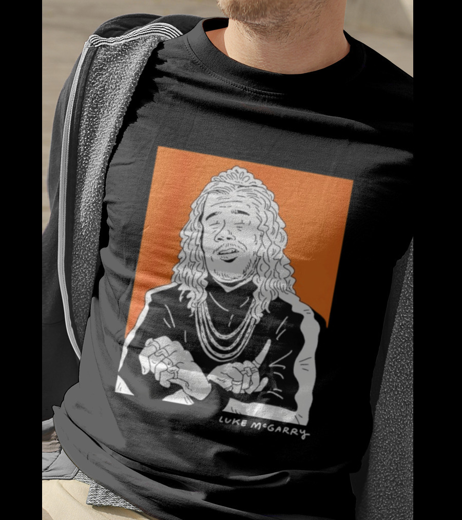 Luke McGarry Cartoon Character With Long Hair And Chains On Orange T-Shirt
