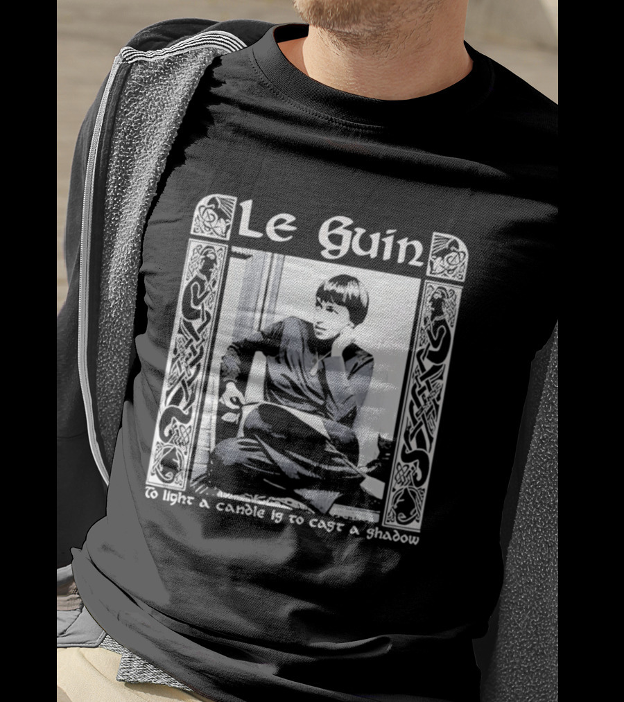 Le Guin To Light A Candle Is To Cast A Shadow T-Shirt