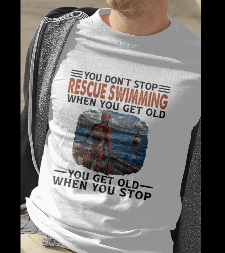 You Don't Stop Rescue Swimming When You Get Old You Get Old When You Stop Rescue Swimmer Standing On Boat Near Lighthouse T-Shirt