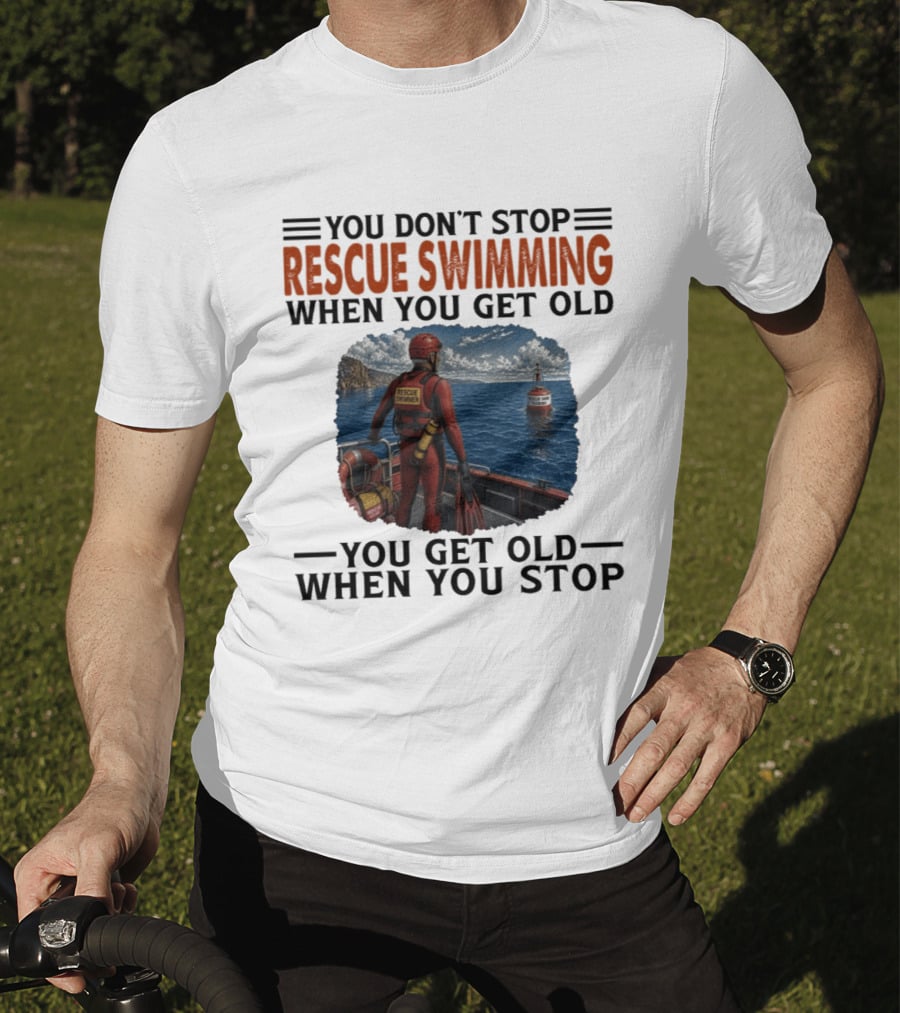 You Don't Stop Rescue Swimming When You Get Old You Get Old When You Stop Rescue Swimmer Standing On Boat Near Lighthouse T-Shirt