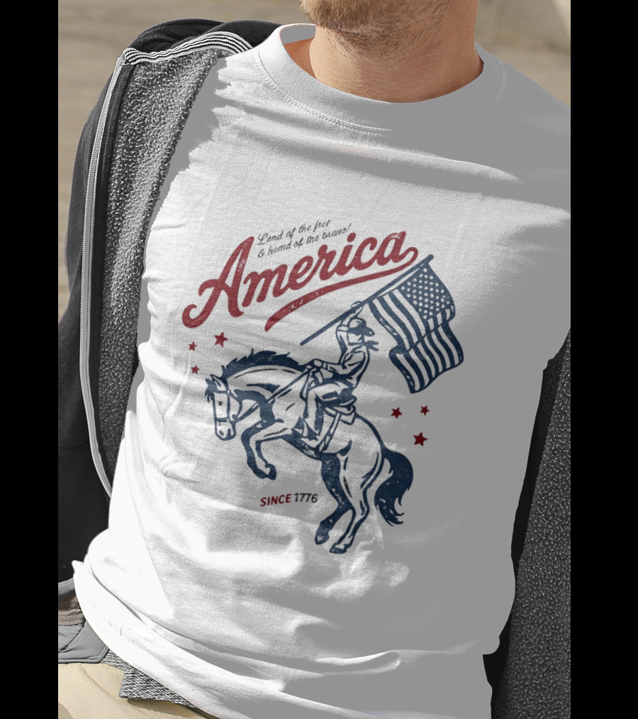 America Land Of The Free Home Of The Brave Since 1776 Cowboy Holding Flag Patriotic T-Shirt
