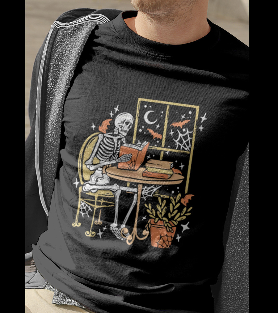 Cartoon Skeleton Reading Under Crescent Moon With Bats Orange Book Table Window T-Shirt