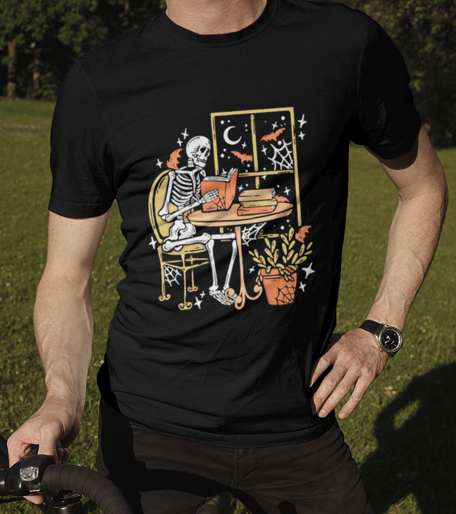 Cartoon Skeleton Reading Under Crescent Moon With Bats Orange Book Table Window T-Shirt