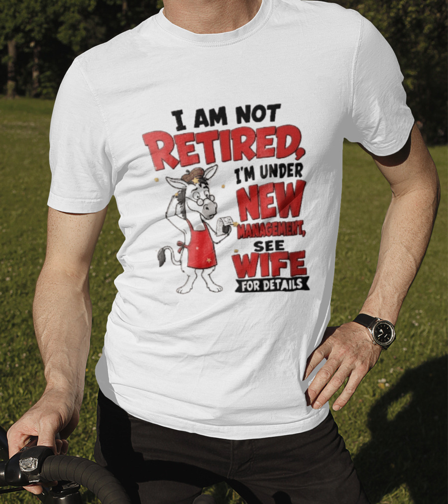 I Am Not Retired I'm Under New Management See Wife For Details Cartoon Donkey Red Apron T-Shirt