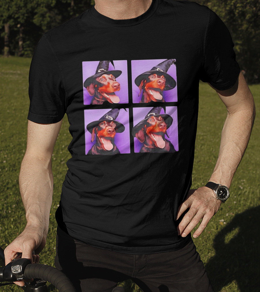 Doberman Pinscher In Witch Hat For Halloween With Purple T-Shirt